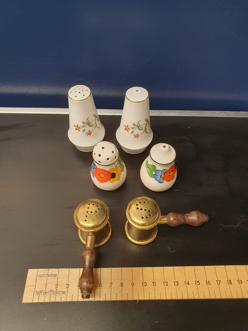Lot 296: A Collection of Vintage Porcelain and Brass Condiment Shakers