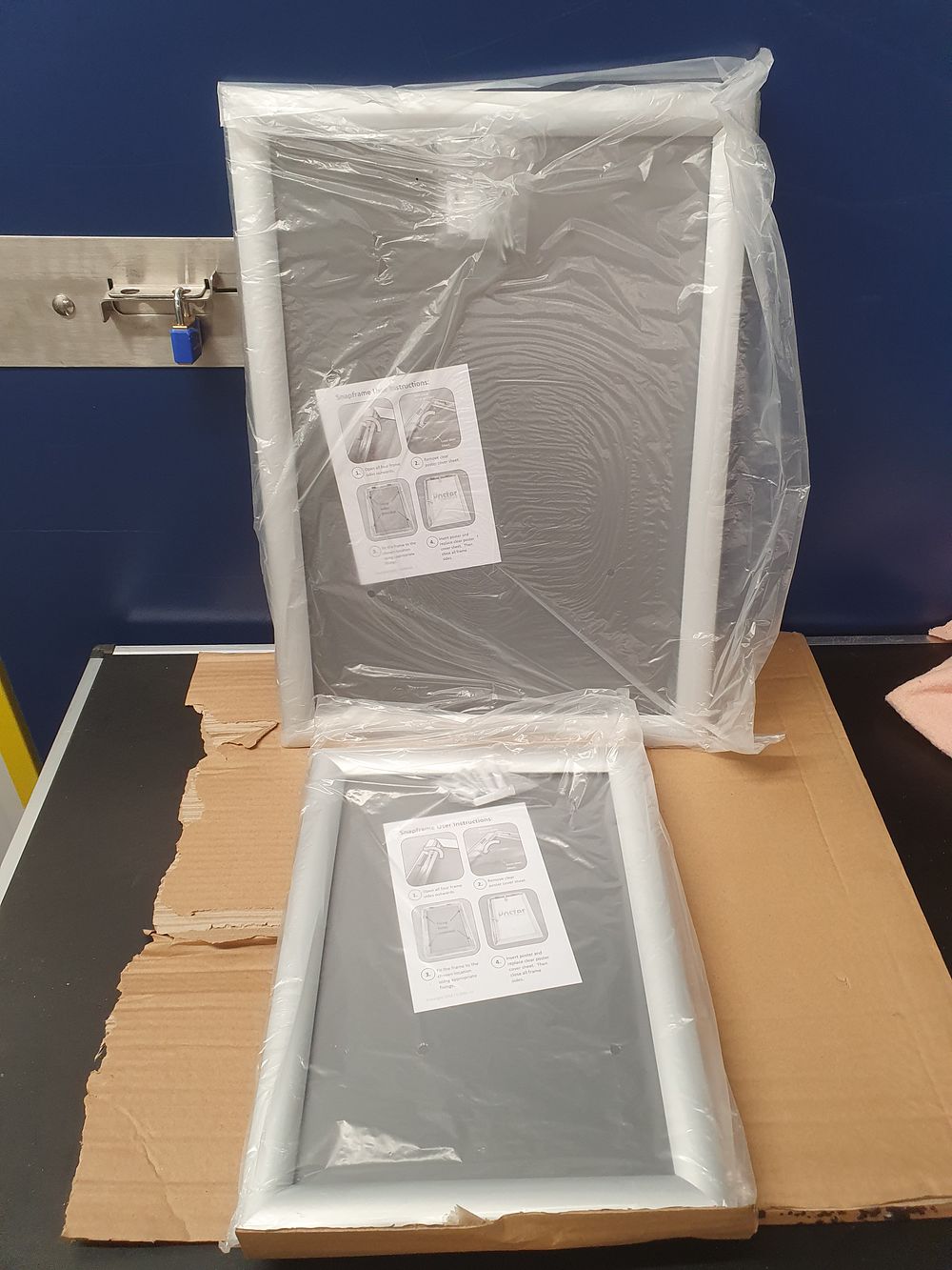 Lot 350: A Pair of Silver Aluminium 25mm Profile Mitred Snap Display Frames, A3 and A4 Sizes