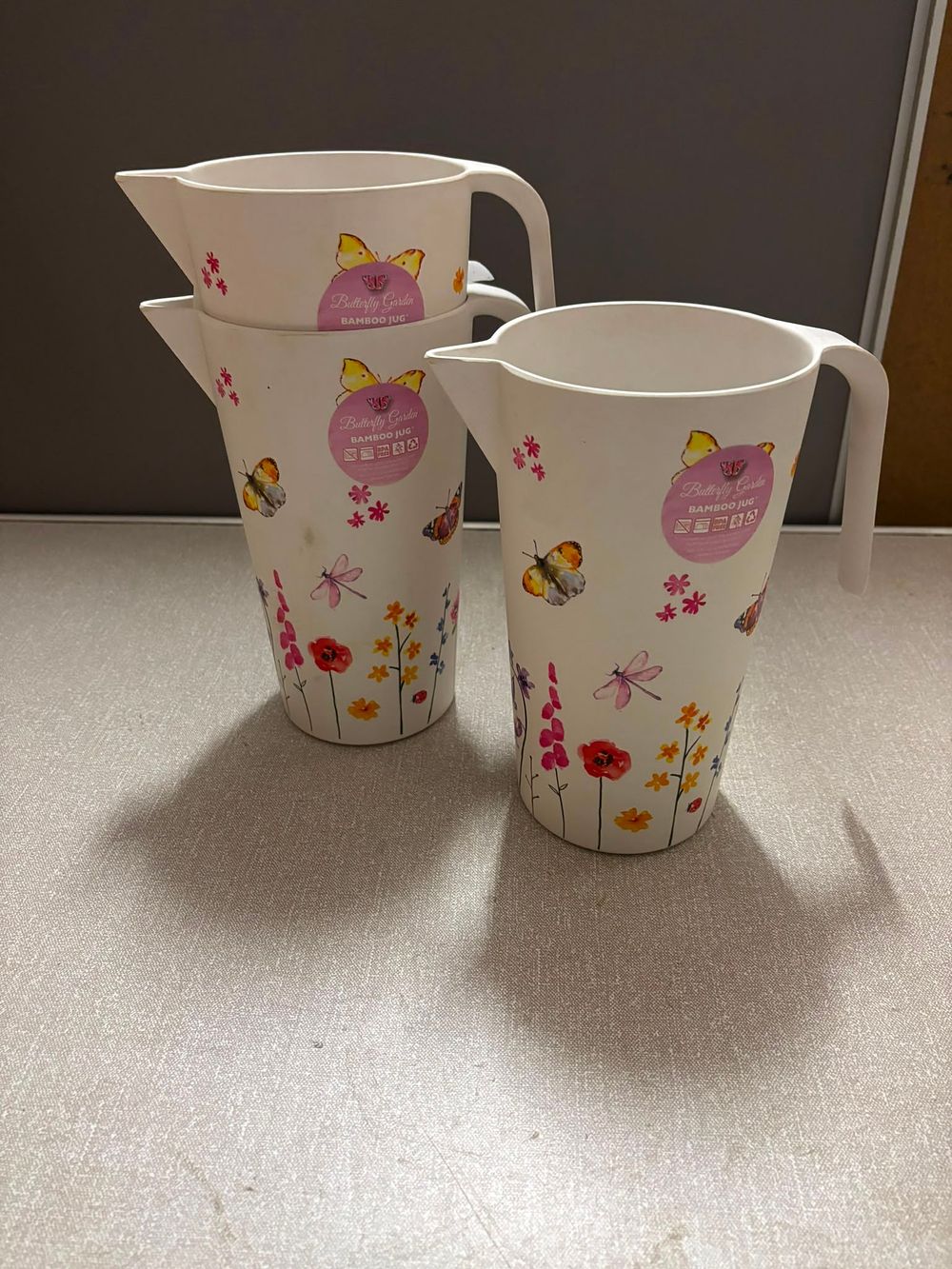 Lot 308: A Trio of New Butterfly Garden Bamboo Jugs