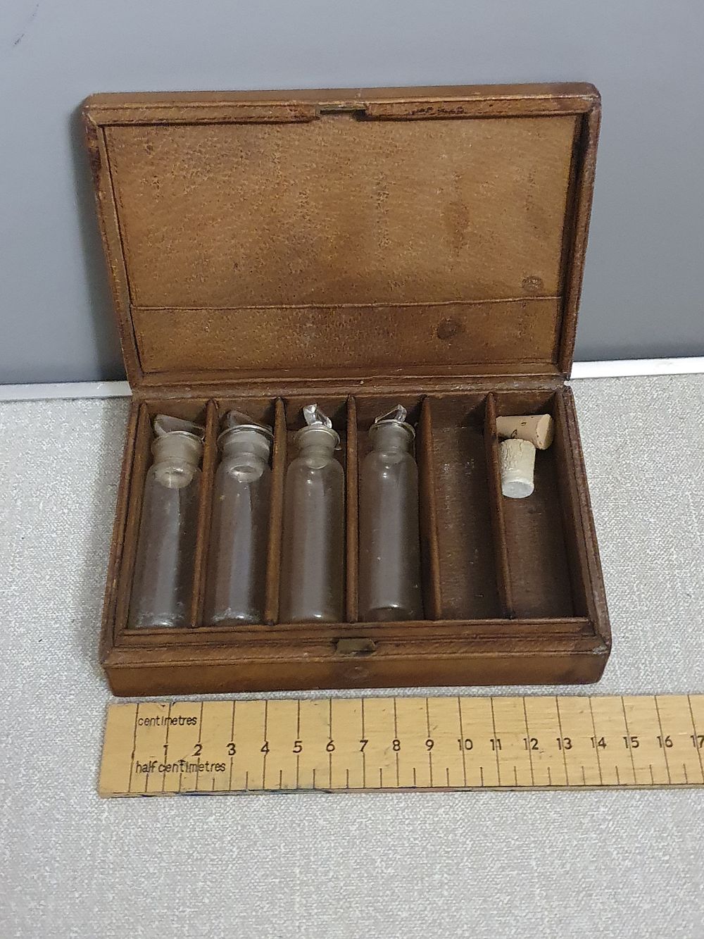 Lot 219: A Victorian Leather-Bound Portable Apothecary Case with Glass Vials