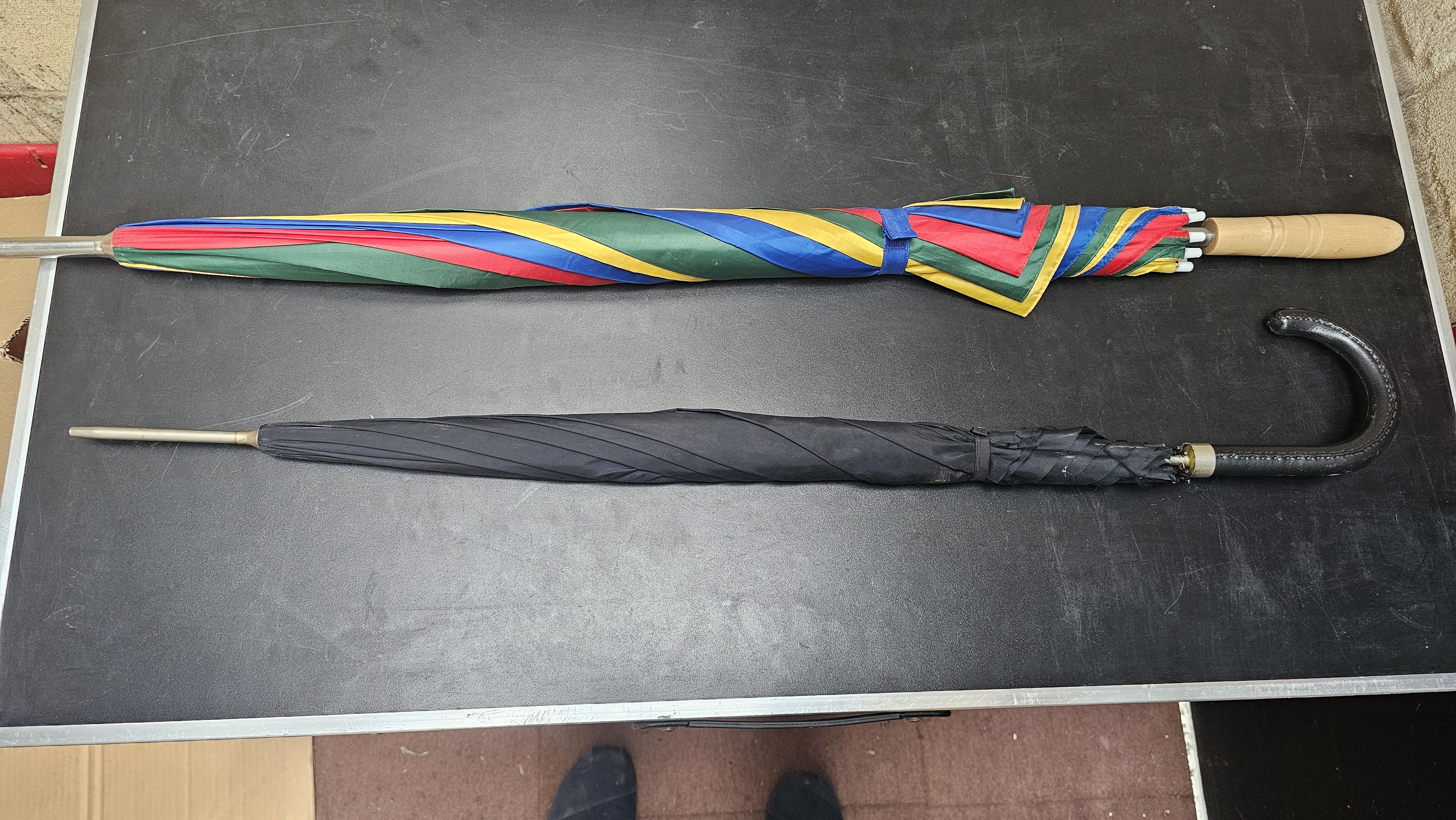 Two Full-Length Walking Umbrellas with Multicoloured and Black Leather-Wrapped Handles