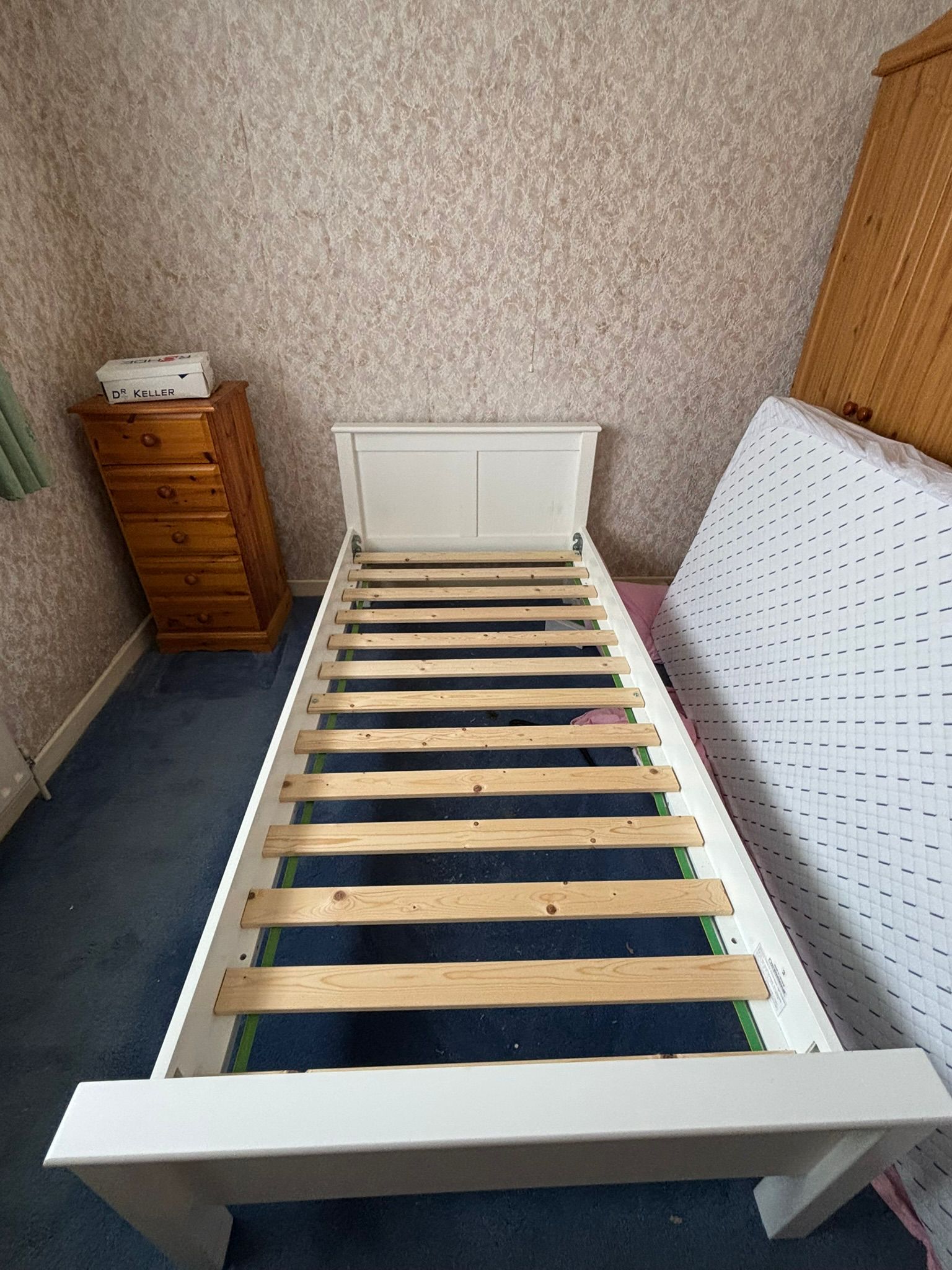 A modern white-painted single bed frame inc clean quality mattress