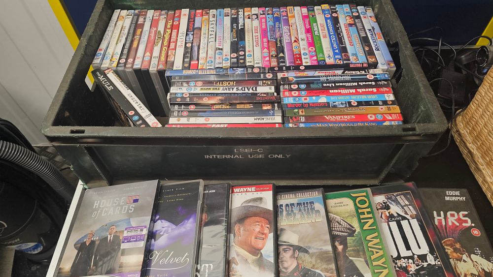 Lot 351: An Assortment of Various Film and Television DVDs in an Industrial Storage Crate