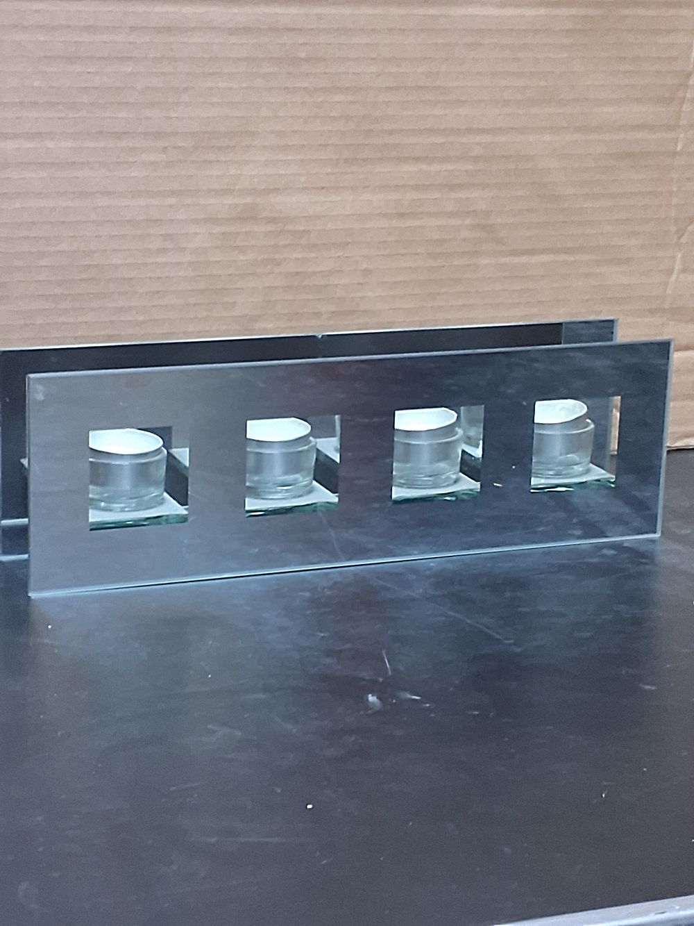 Lot 231: A Contemporary Glass and Polished Metal Tea Light Holder with a Set of Tea Lights