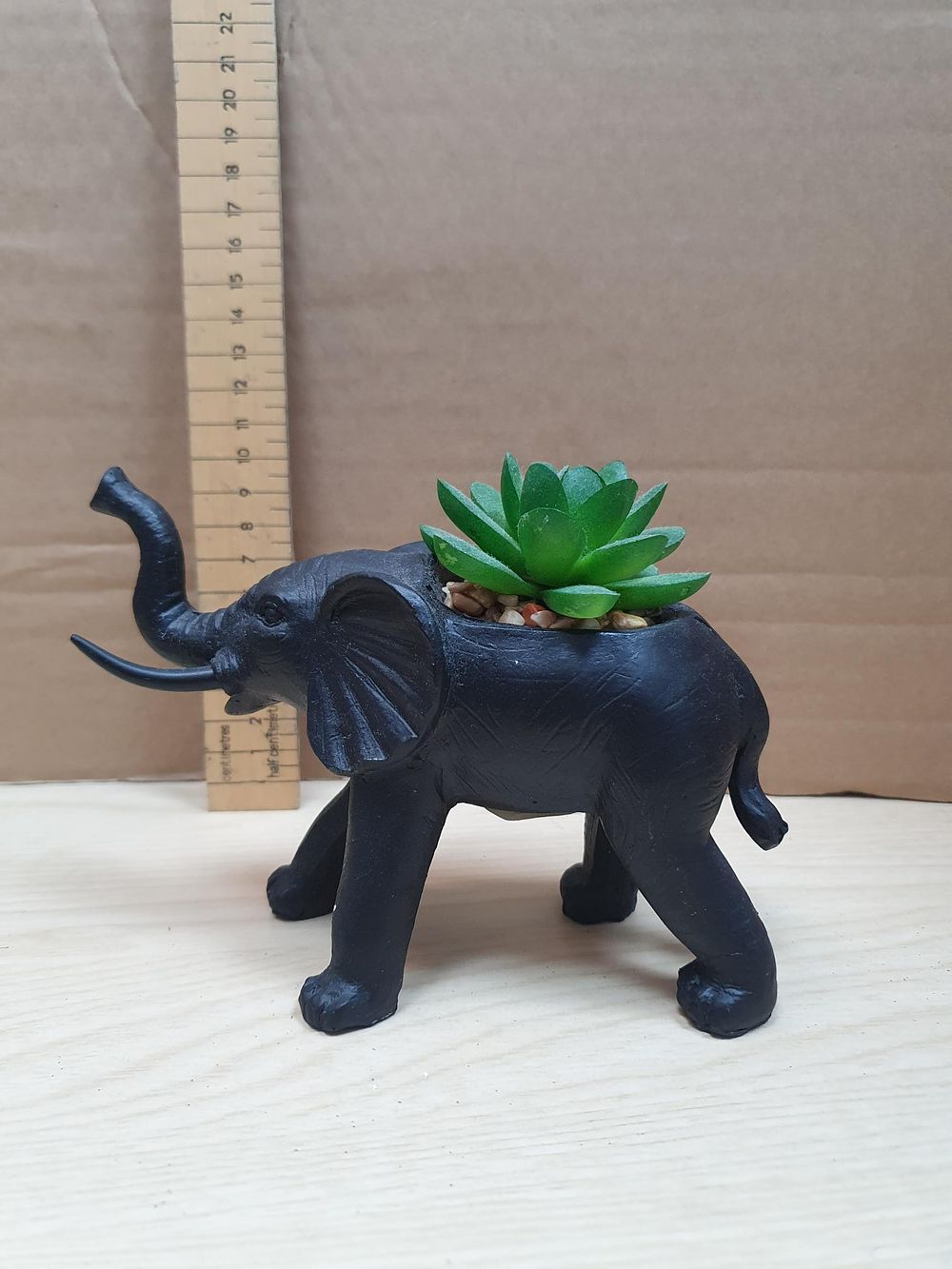 Lot 268: A Contemporary B&M Matte Black Resin Elephant Succulent Planter