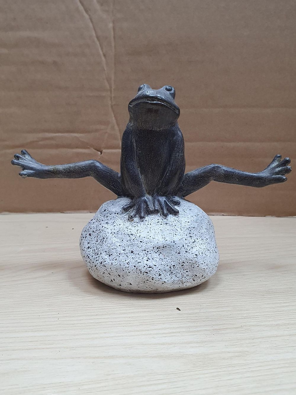 Lot 271: A Cold Cast Resin Leaping Frog Ornament on a Speckled Stone Effect Base