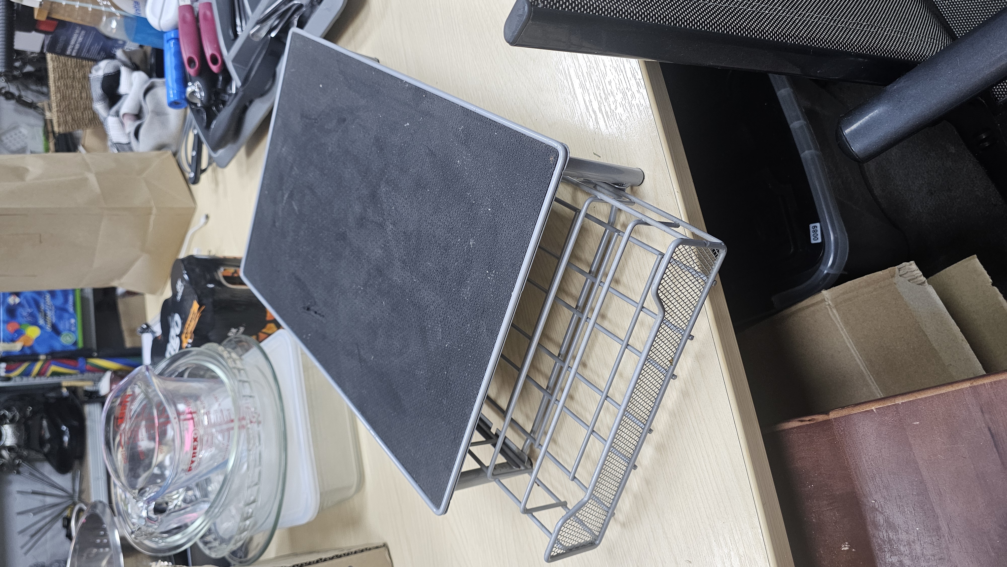 A Grey Metal Coffee Pod Storage Drawer and Machine Riser