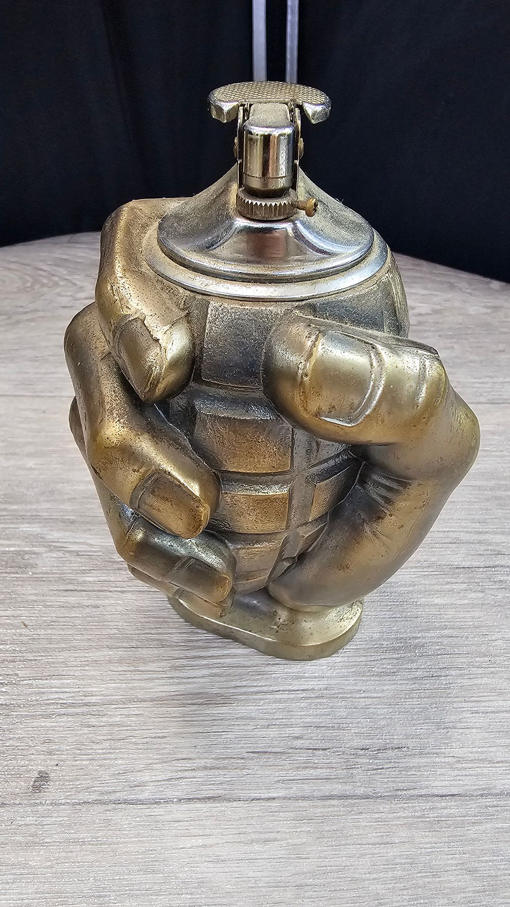 Lot 88: Cast Brass Hand Clutching Grenade Cyprus Souvenir Table Lighter - Very Good Condition
