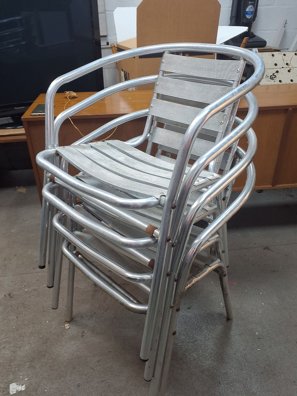 Lot 222: Set of Four Stackable Aluminium Slatted Cafe Armchairs - Used Condition