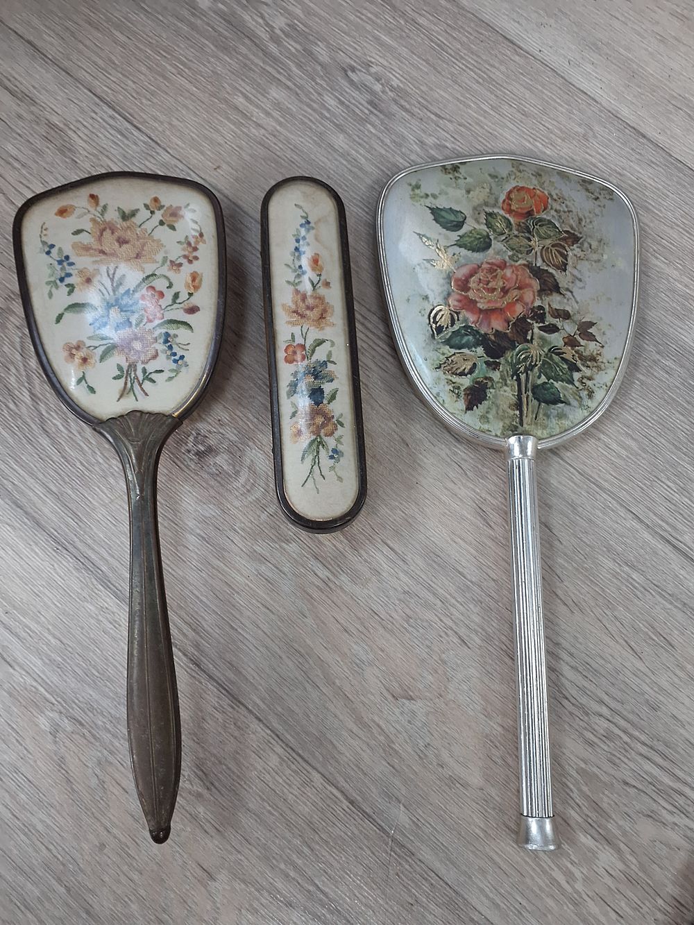 Lot 204: Silver Toned Floral Petit Point Needlework Three Piece Vanity Set - Good Used Condition