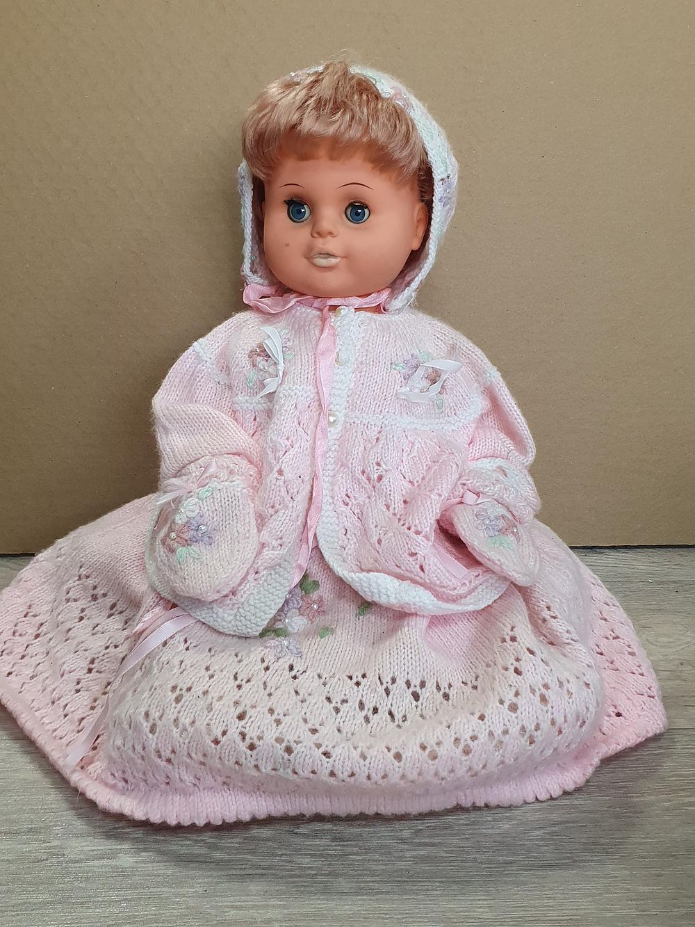 Lot 216: Mid-Century Vinyl Baby Doll in Hand Knitted Pink Ensemble