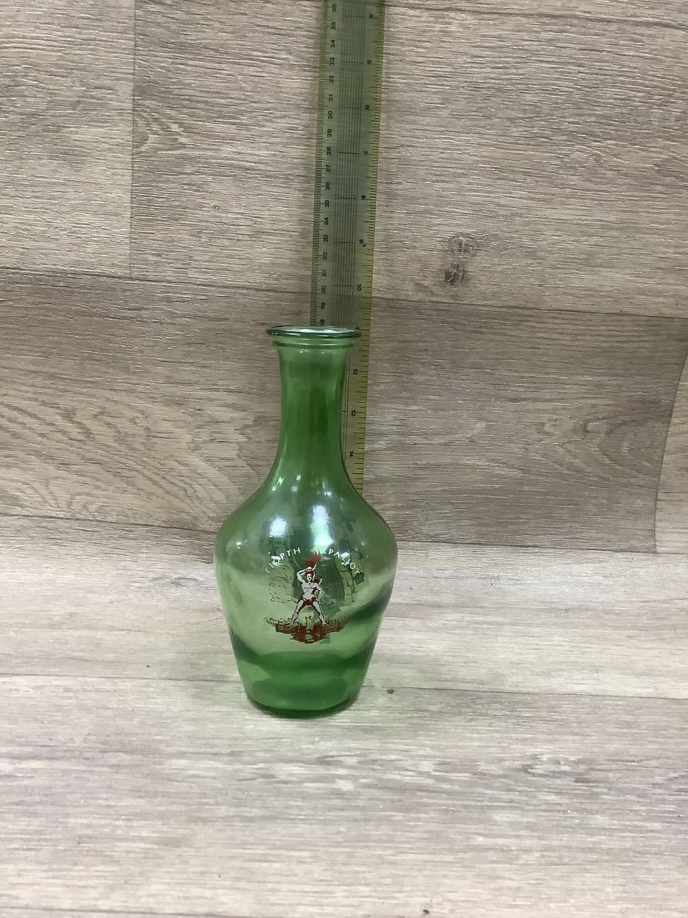Lot 219: Green Glass Souvenir Bottle with Hand-Painted Greek Figures - Very Good Condition