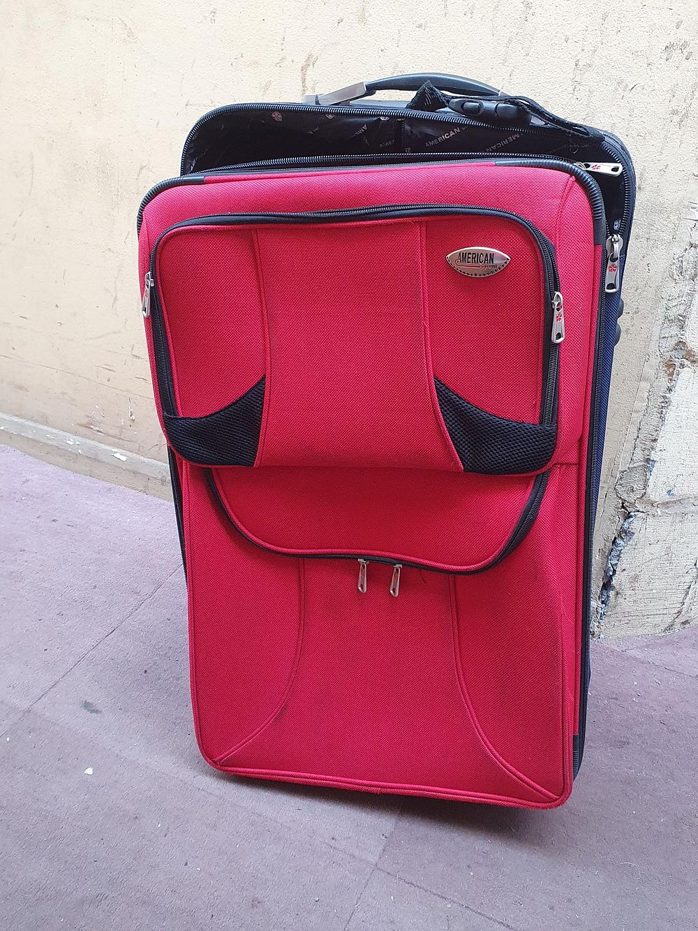 Lot 108: American Navy Blue and Red Softside Two Wheel Upright Suitcase