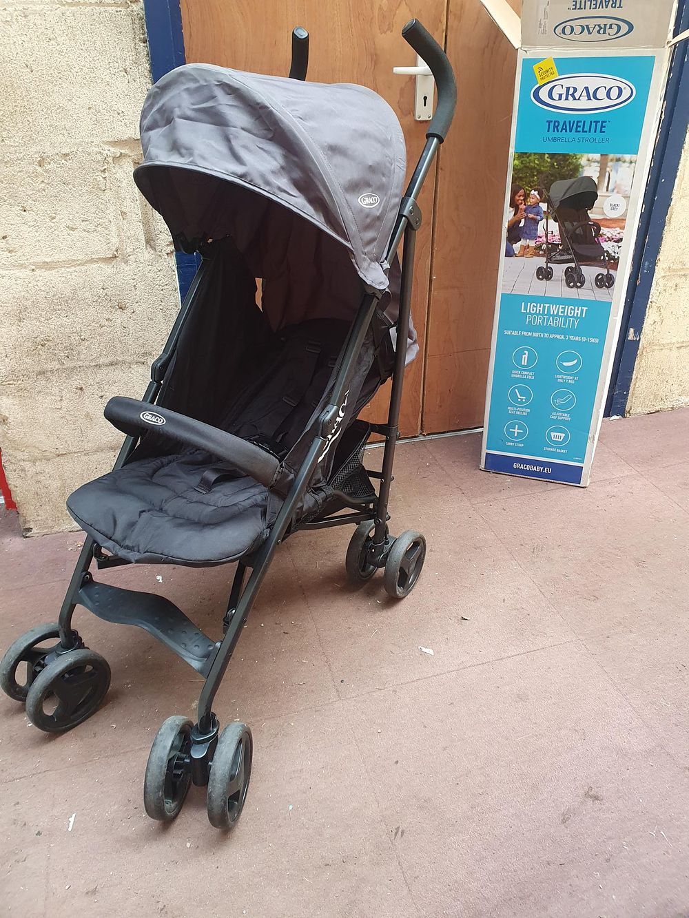 Lot 145: Graco TraveLite Black and Grey Umbrella Stroller - Used Condition