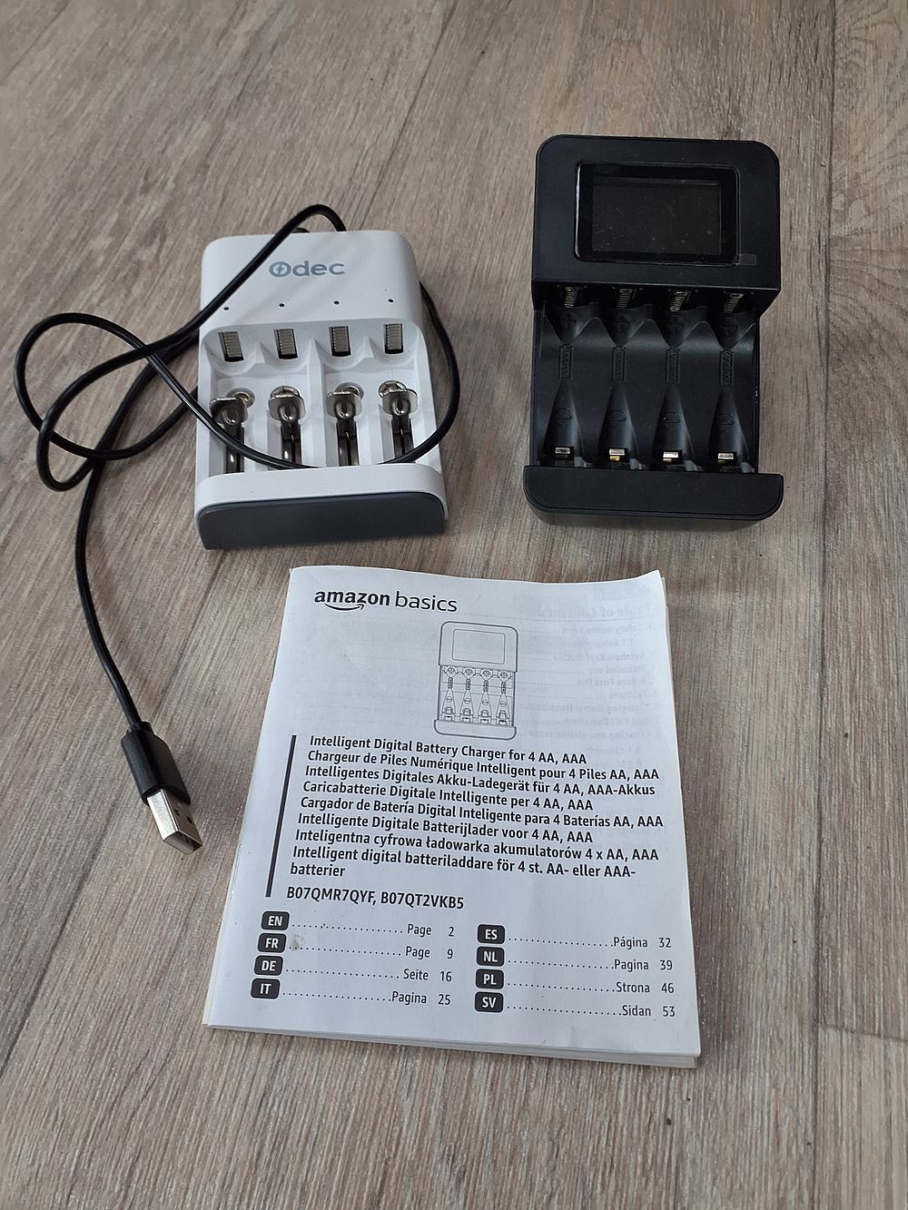 Lot 171: Amazon Basics B07QMR7QYF and Odec Black and White Battery Chargers - Very Good Condition