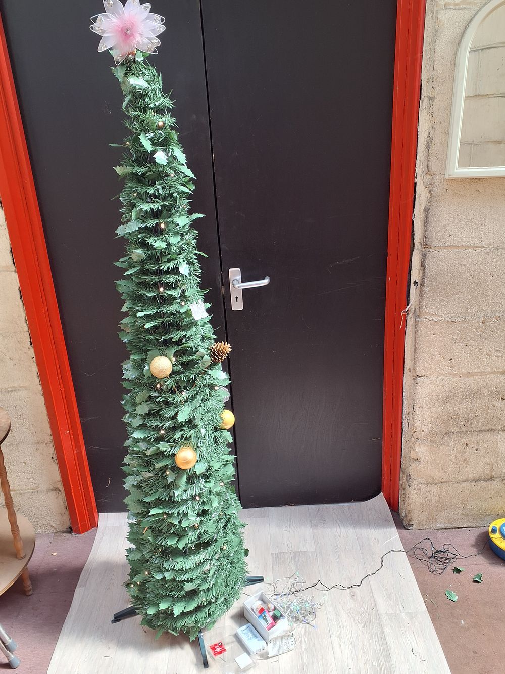 Lot 266: A Pre-Lit Pop-Up Slim Profile Artificial Christmas Tree with Decorations