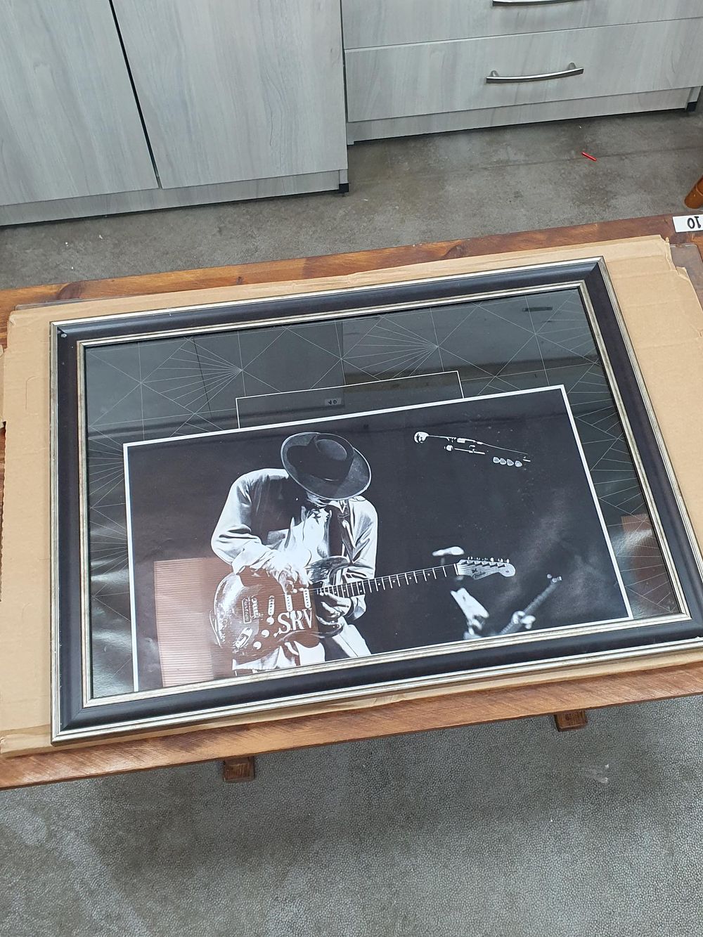 Lot 281: Stevie Ray Vaughan Framed Black and White Performance Photograph - Very Good Condition