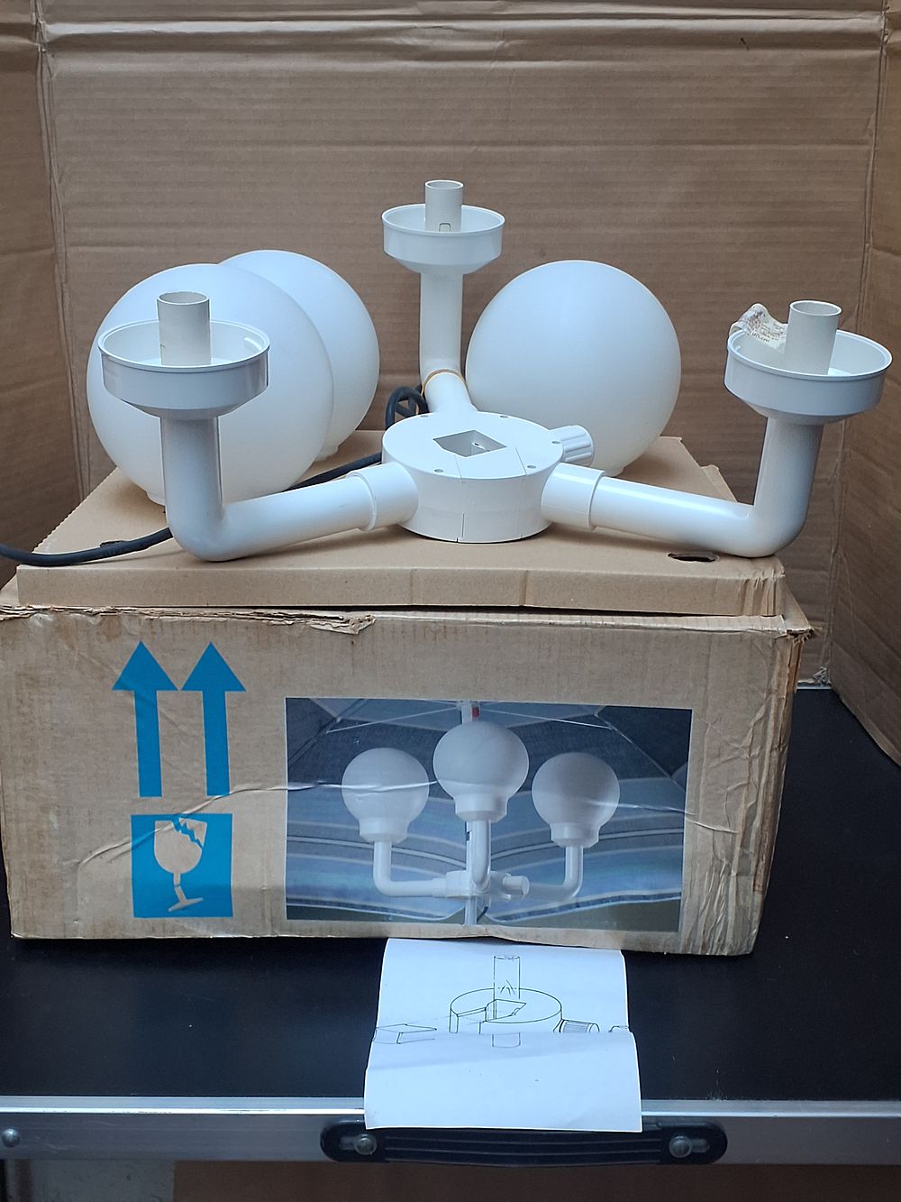 Lot 303: A Three-Arm Modernist Parasol light with Spherical Opal Shades - Very Good Condition