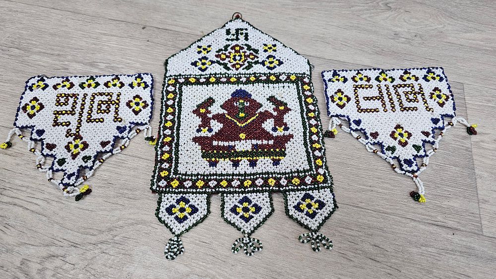 Lot 326: Three Piece Moti Bharat Beaded Hindu Wall Hanging Set