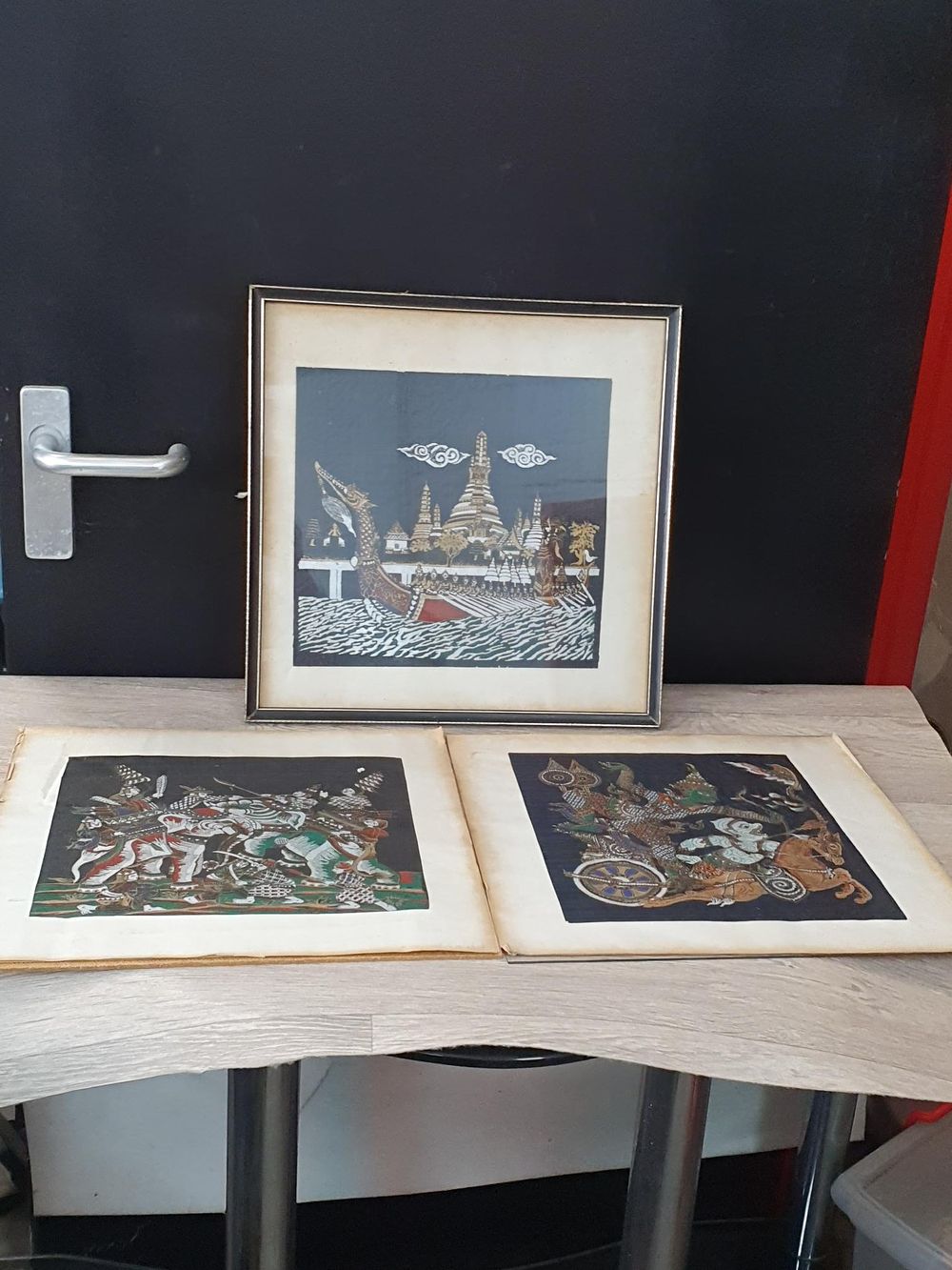 Lot 283: Trio of Thai Gilt Polychrome Fabric Paintings of Traditional Scenes - Good Condition