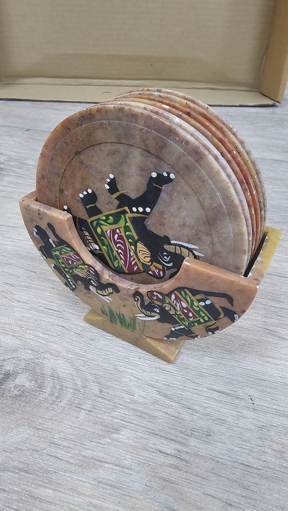 Lot 324: Hand Painted Soapstone Elephant Coaster Set with Holder - Very Good Condition