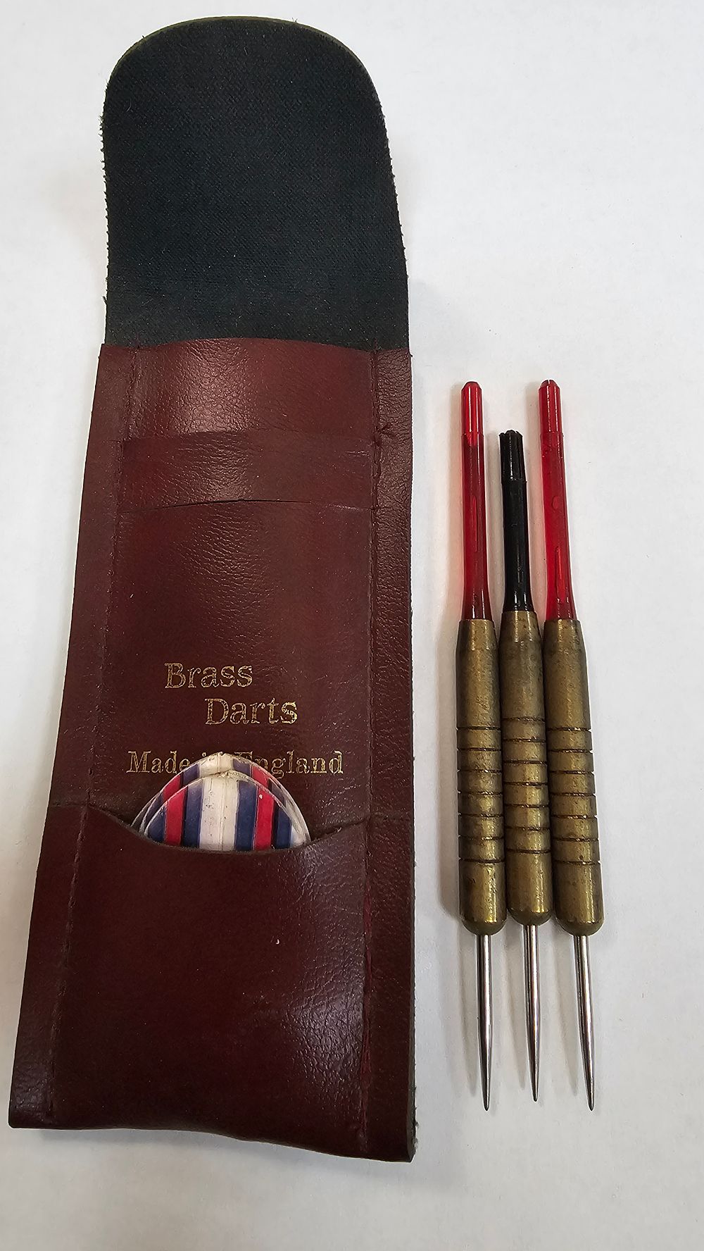 Lot 303: Three Brass Barrelled Steeltip Darts with Maroon Protective Pouch - good condition