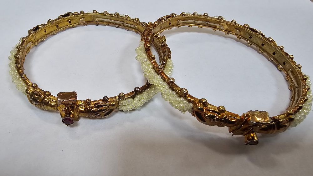 Lot 250: Pair of Gold Tone Traditional Indian Makara Bangles - Very Good Condition