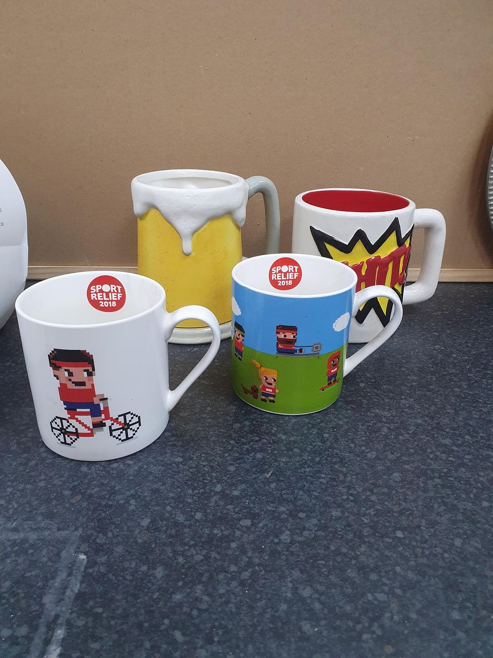Lot 221: Sport Relief 2018 Ceramic Pixel Art and Novelty Mug Collection