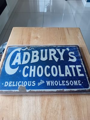 Cadbury's Chocolate Decorative Vintage Style Metal Tin Sign. This is a contemporary decorative 