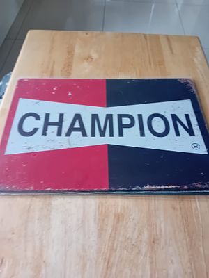 Champion Spark Plug Advertising Sign. Champion Spark Plug advertising sign featuring the brand 