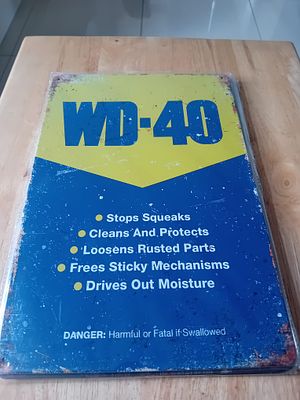 WD-40 Decorative Metal Garage Sign. A modern, vintage-style metal advertising sign for WD-40 