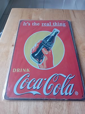 Coca-Cola It's the Real Thing Metal Advertising Sign. This is a vertical rectangular metal 