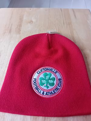 Cliftonville Football & Athletic Club Red Knit Beanie Hat. A solid red ribbed-knit beanie hat 