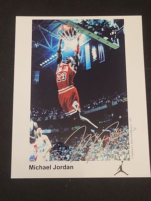 I01569 | Michael Jordan Hand Signed Chicago Bulls Nathaniel S. Butler 1997 NBA Photograph. BID 