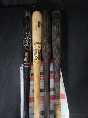 I01988 | A Collection of Four Professional Model Baseball Bats Including Lance Johnson, Glenn 