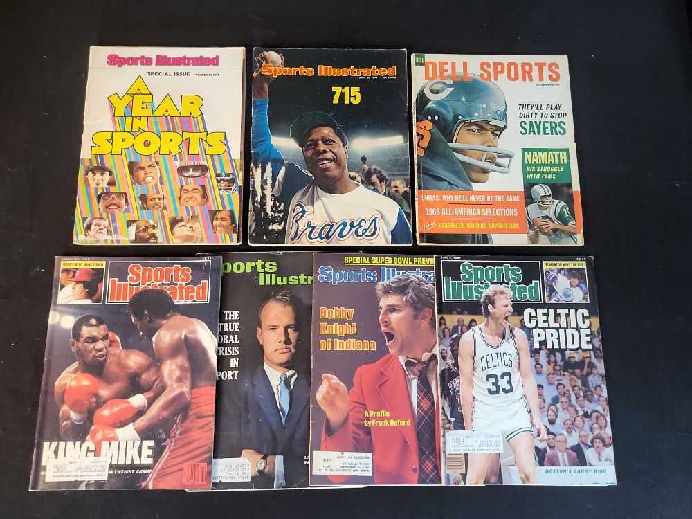 Lot 249: I01061 | Collection of Vintage Sports Illustrated and Dell Sports Magazines Featuring Hank Aaron, Mike Tyson, and Larry Bird, No Authentication