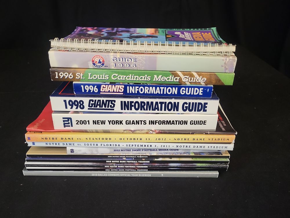 Lot 296: I01347 | A Collection of Professional and Collegiate Sports Media Guides, Programs, and Yearbooks