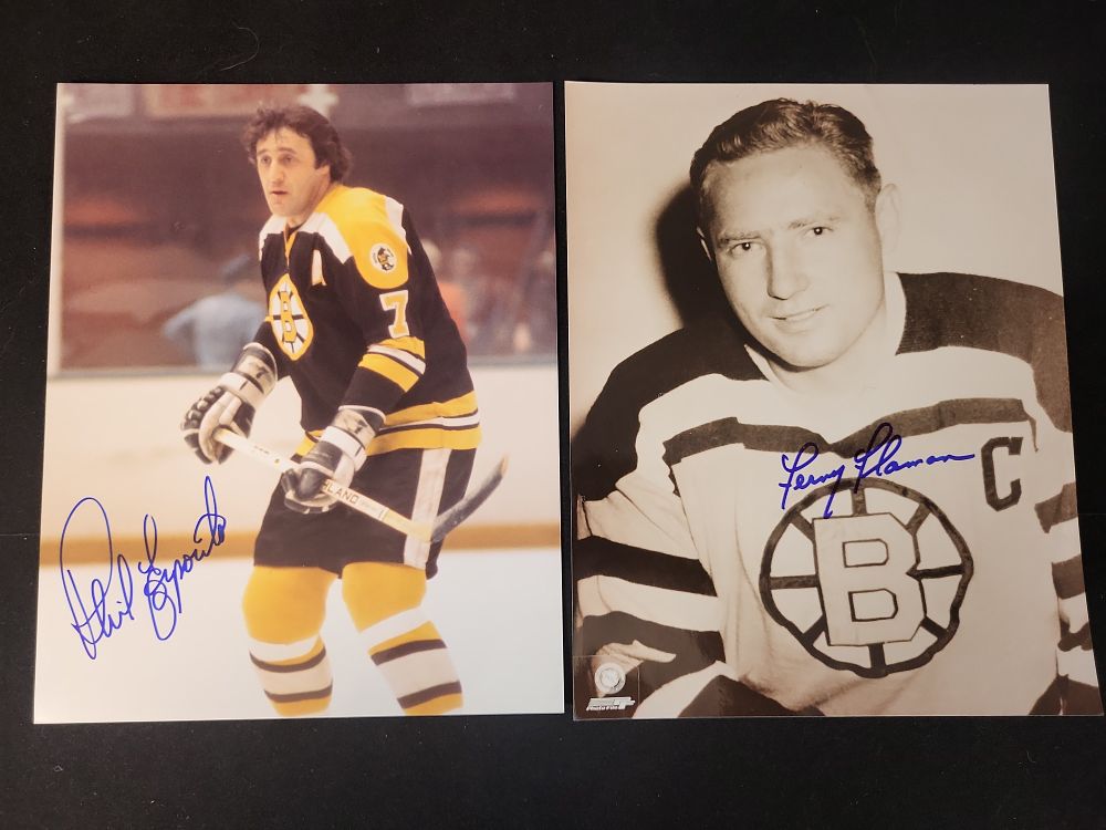 Lot 299: I01446 | Two Boston Bruins Autographed 8x10 Photographs featuring Phil Esposito and Fern Flaman