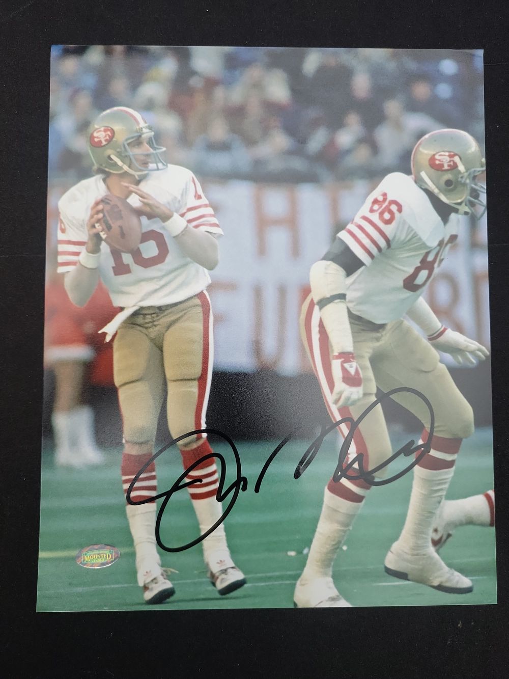 Lot 349: I01696 | Dwight Clark Autographed 8x10 Photograph featuring Joe Montana San Francisco 49ers Mounted Memories COA