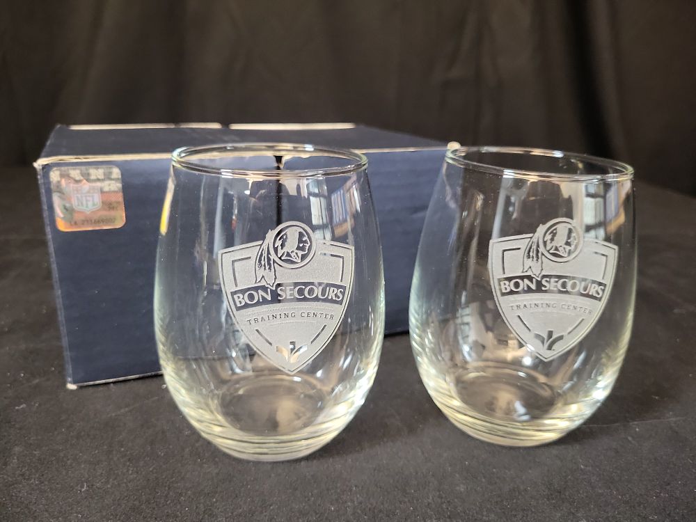 Lot 379: I01867 | A Pair of Washington Redskins Bon Secours Training Center Etched Stemless Wine Glasses