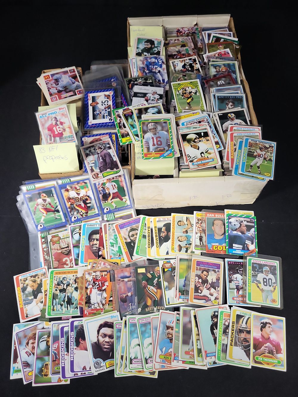Lot 390: I01777 | An Assortment of Vintage to Modern Football Trading Cards Including 1981 Topps Joe Montana and 1976 Topps Walter Payton Rookie Cards