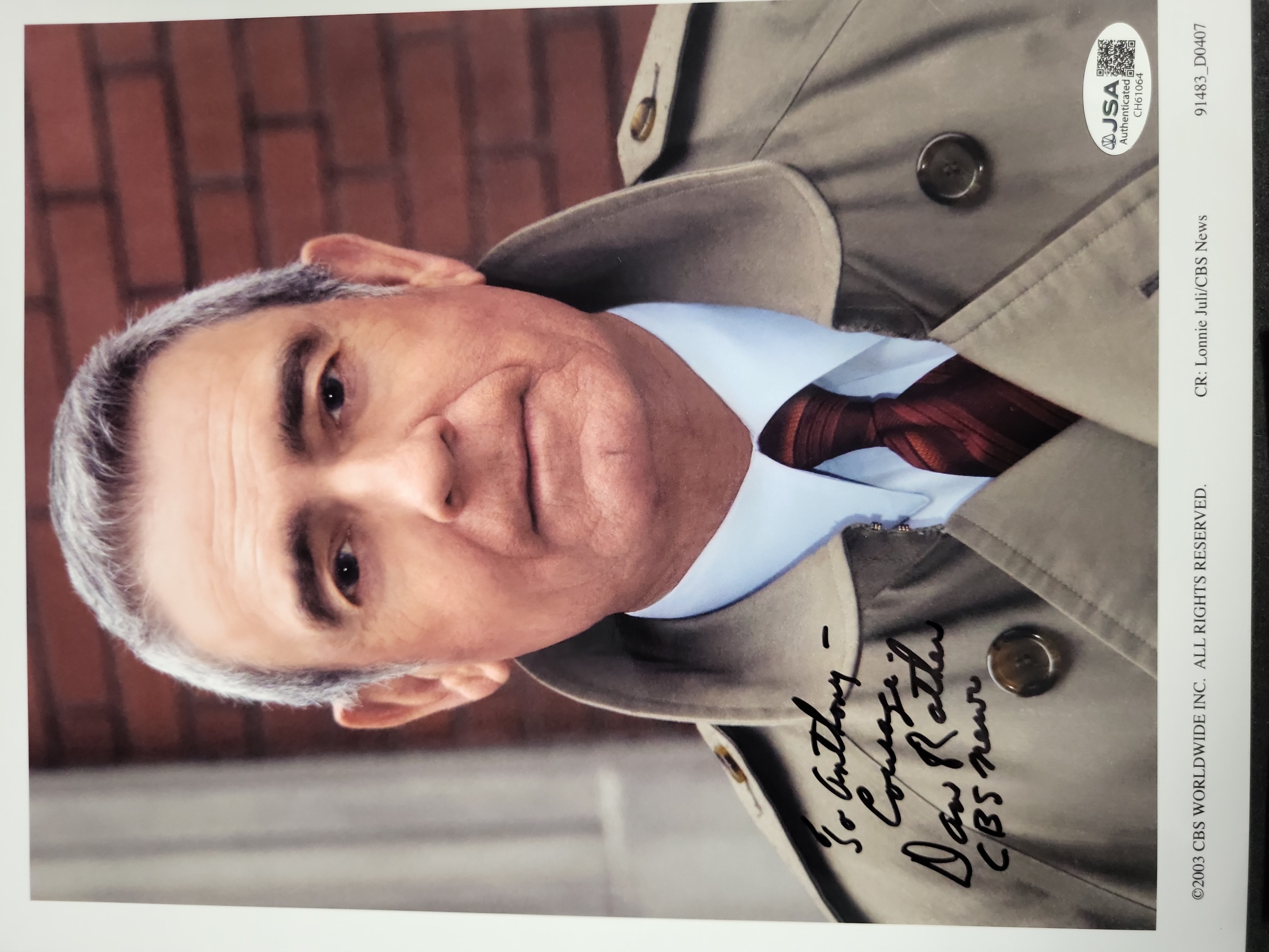 I03393 | A Trio of Autographed Celebrity Memorabilia Items Featuring Dan Rather, George Peppard, and Robert Stack with JSA Authentication