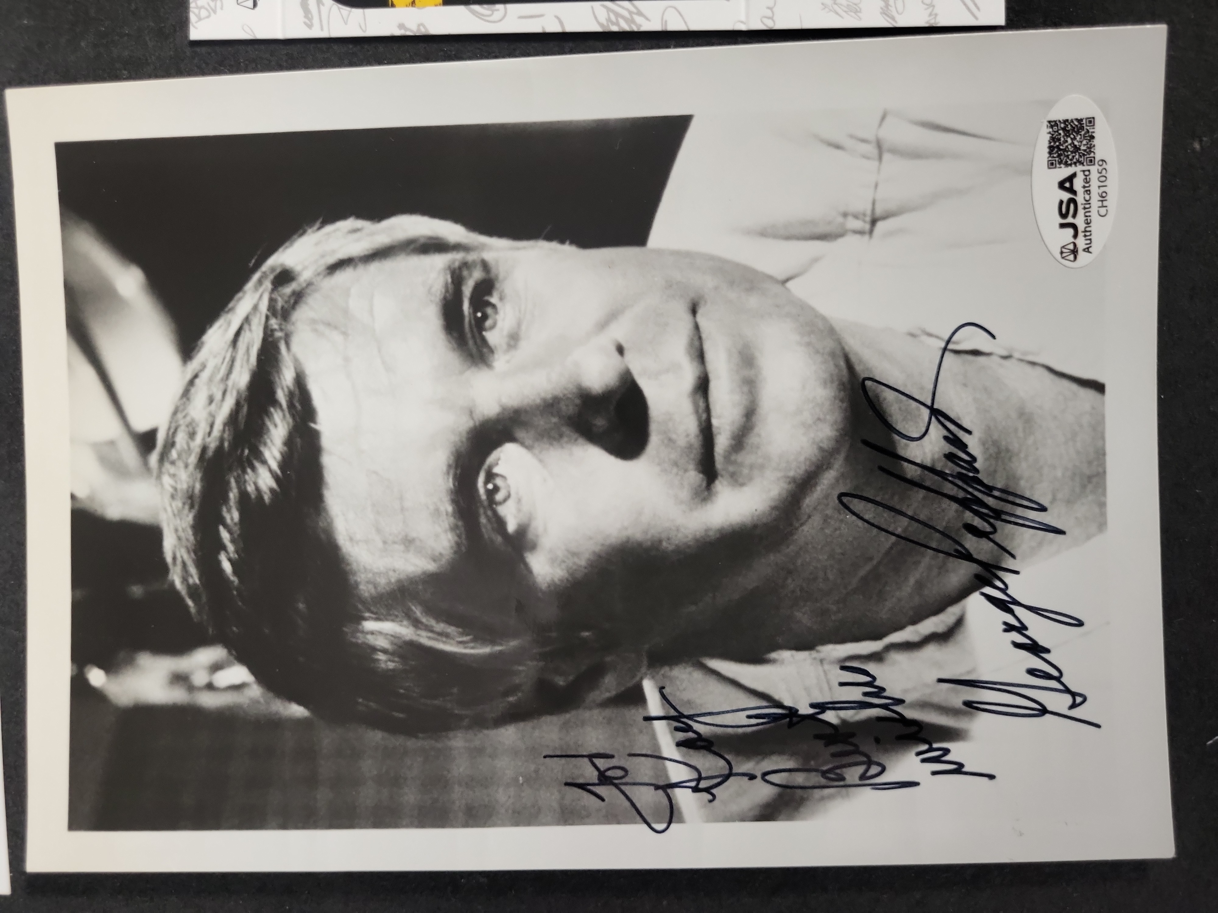 I03393 | A Trio of Autographed Celebrity Memorabilia Items Featuring Dan Rather, George Peppard, and Robert Stack with JSA Authentication