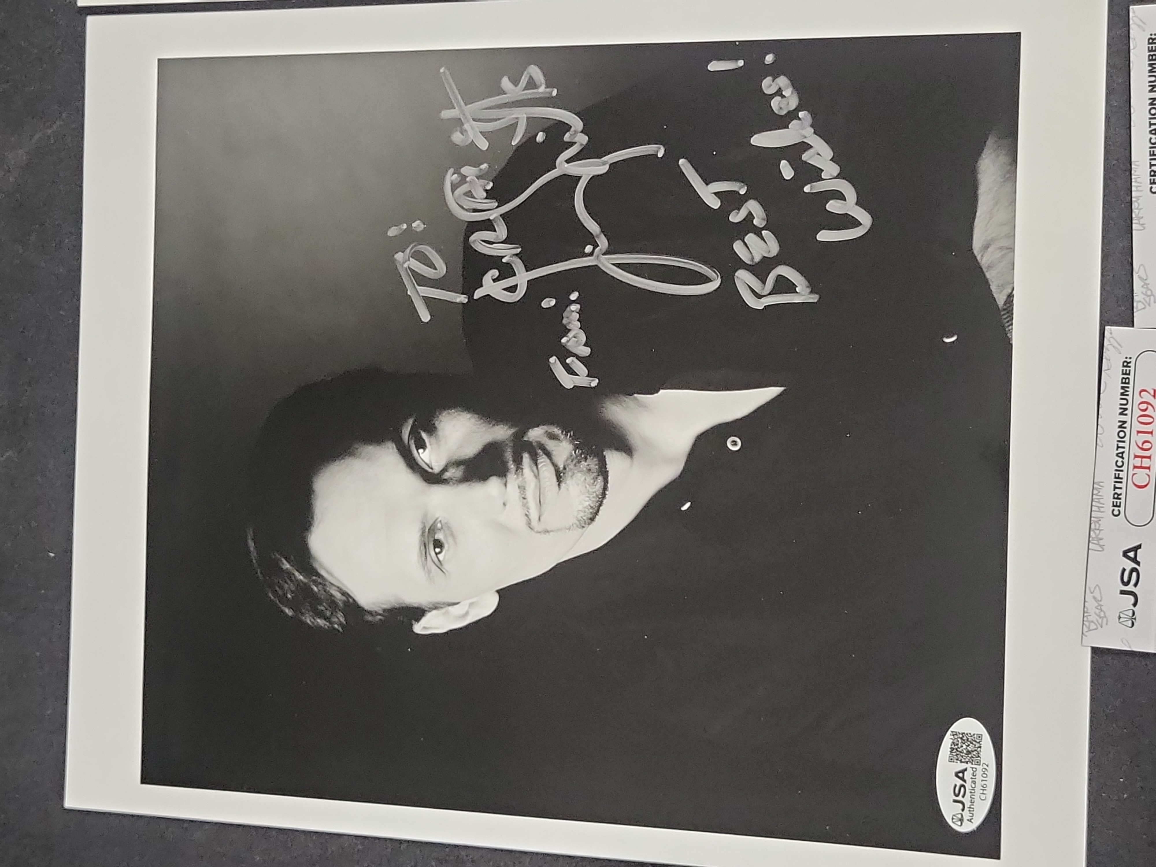 I03400 | Two Jimmy Smits and Oliver Stone JSA Authenticated Autographed Photographs