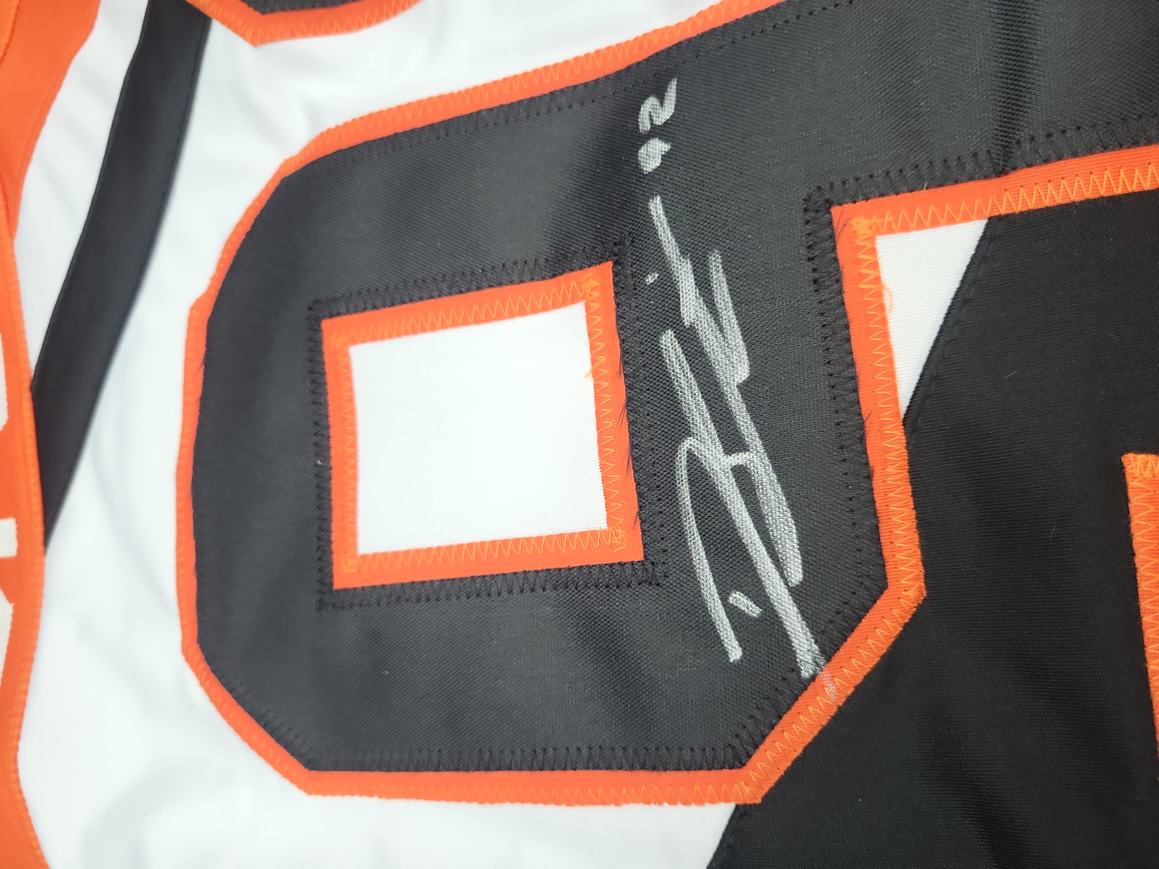 I03559 | Dhane Smith Signed Buffalo Bandits NLL Lacrosse Jersey with Inscriptions and JSA Authentication