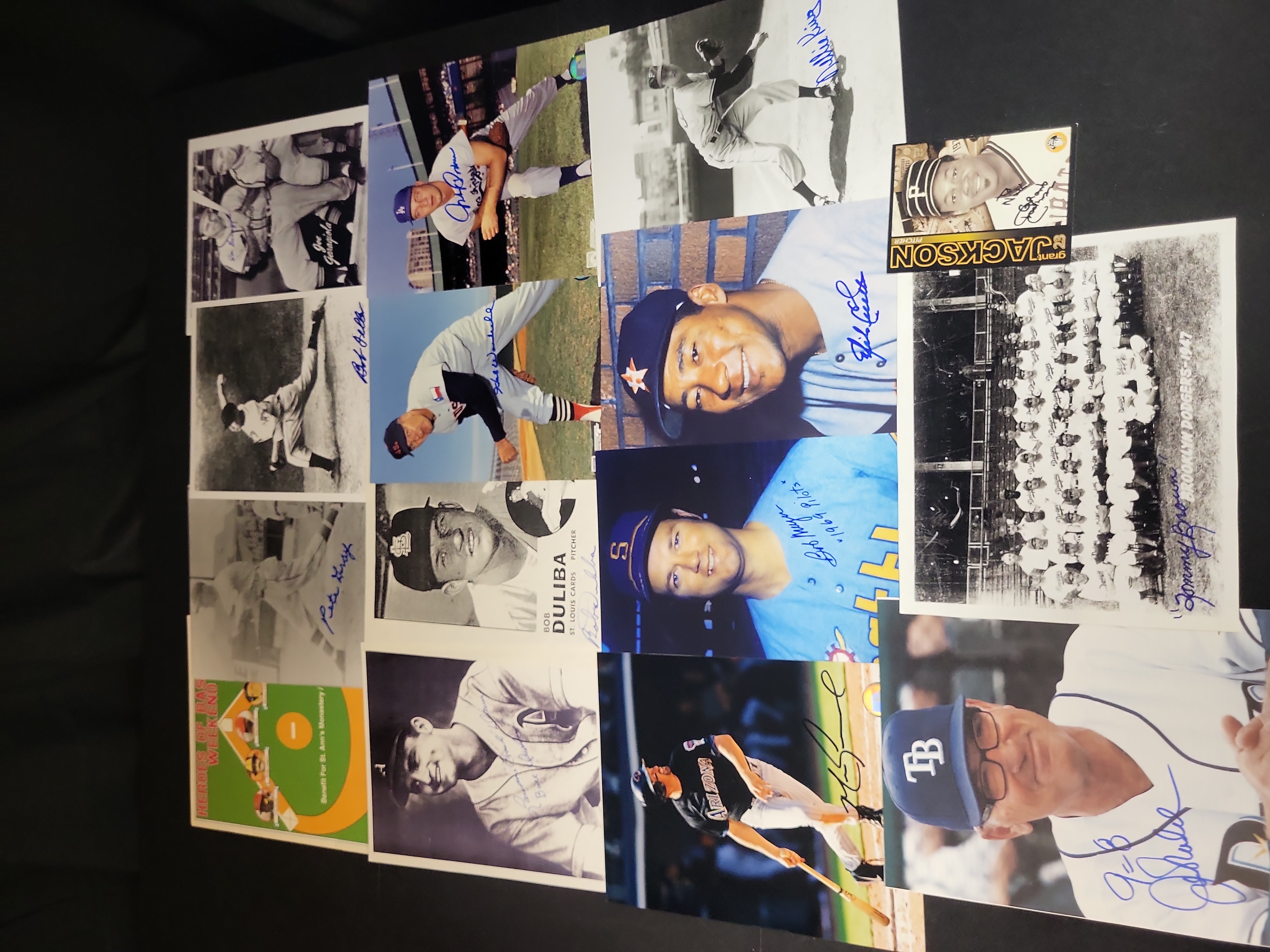 I03024 | A Collection of Signed Baseball Photographs and Memorabilia Featuring Bob Feller, Joe Maddon, and Others