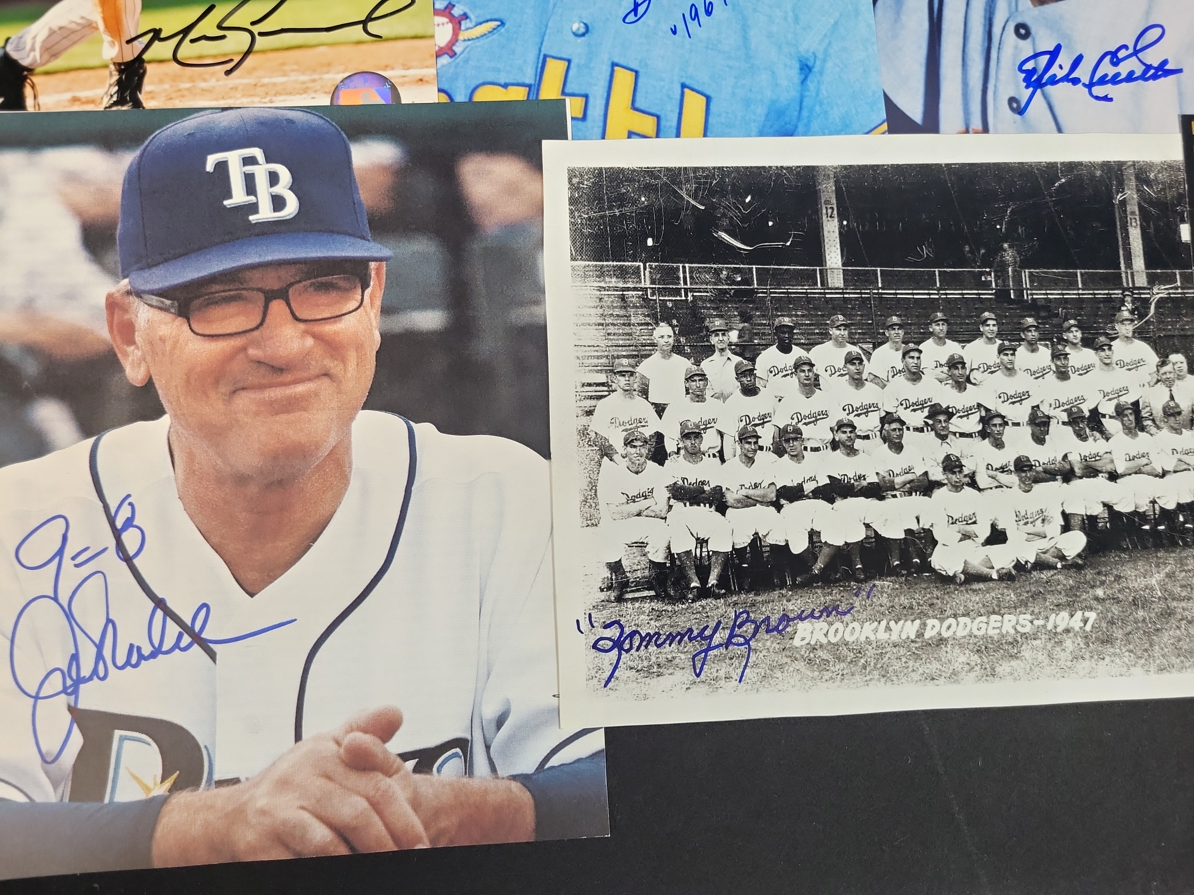 I03024 | A Collection of Signed Baseball Photographs and Memorabilia Featuring Bob Feller, Joe Maddon, and Others