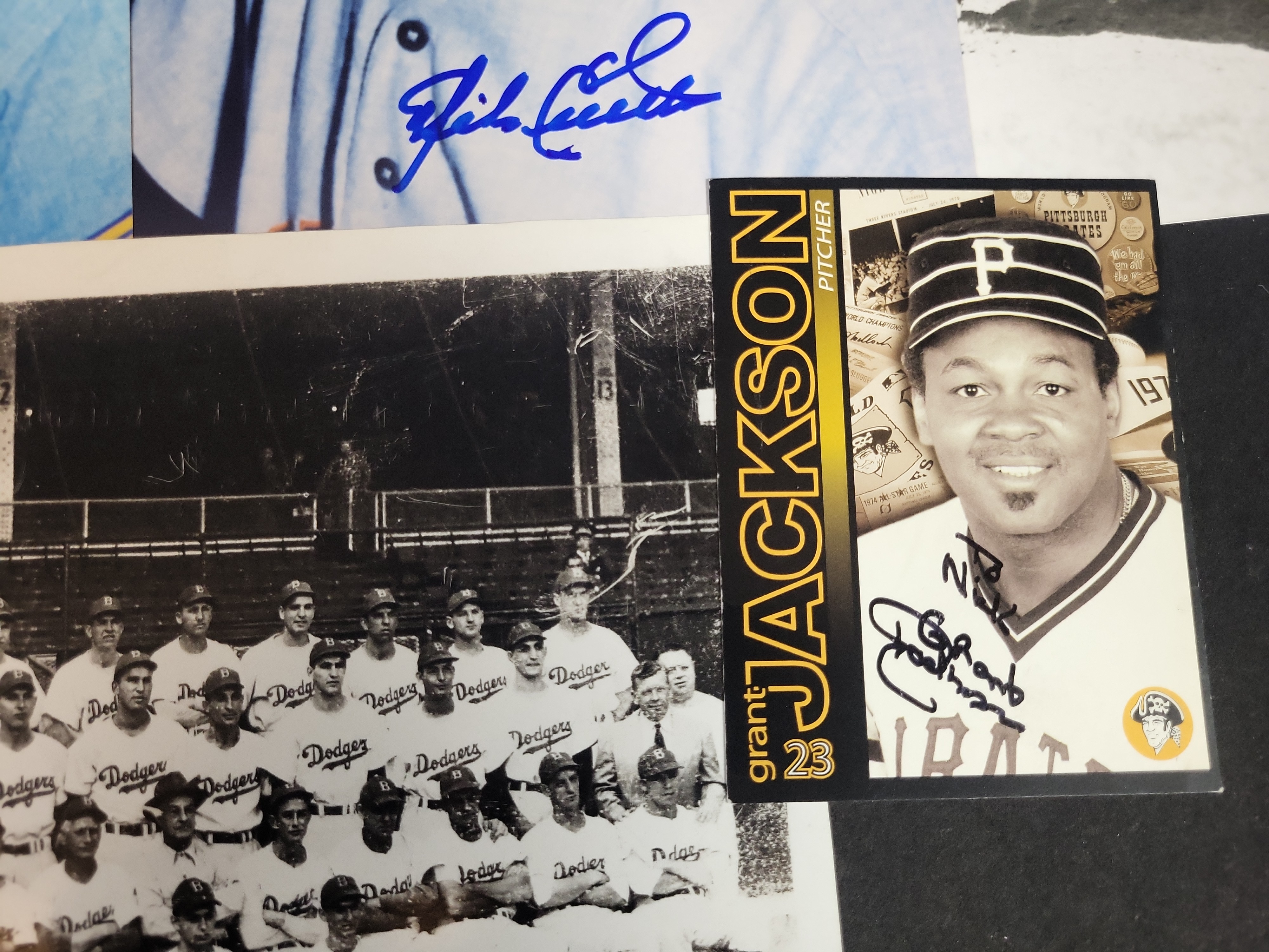 I03024 | A Collection of Signed Baseball Photographs and Memorabilia Featuring Bob Feller, Joe Maddon, and Others