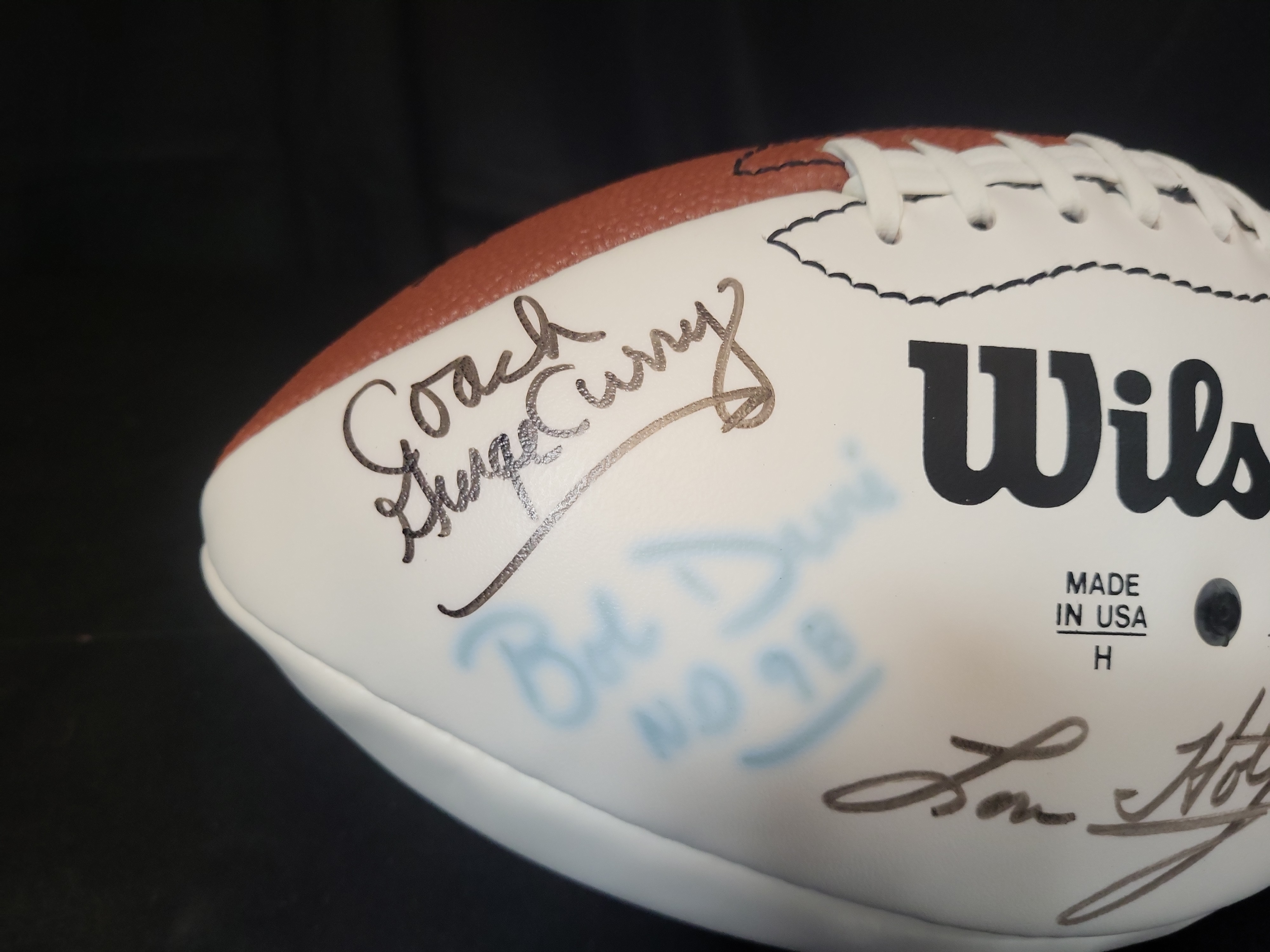 I03068 | Wilson NFL Multi Signed Football Featuring Lou Holtz Ron Powlus and Coach George Curry