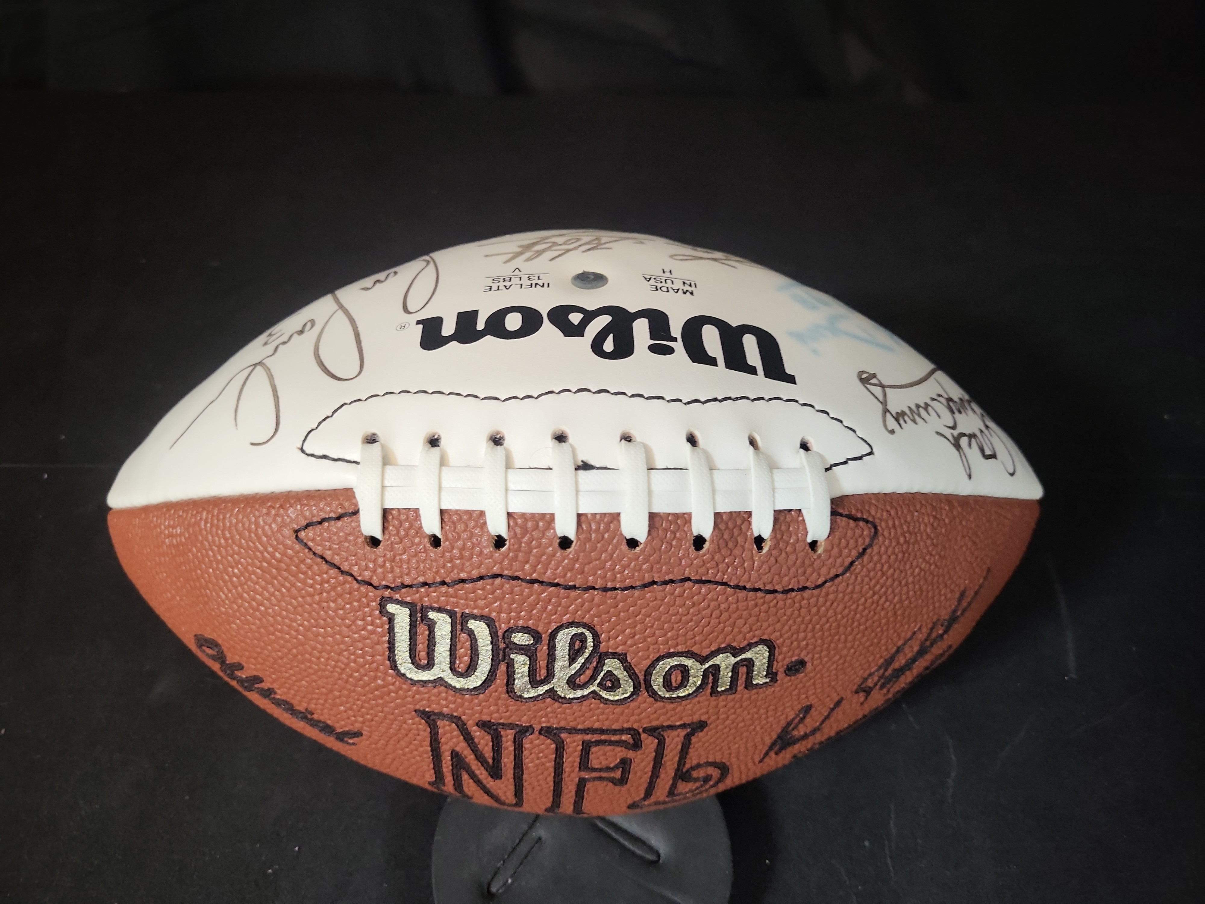 I03068 | Wilson NFL Multi Signed Football Featuring Lou Holtz Ron Powlus and Coach George Curry